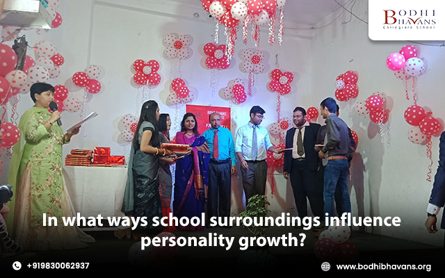 In what ways school surroundings influence personality growth?